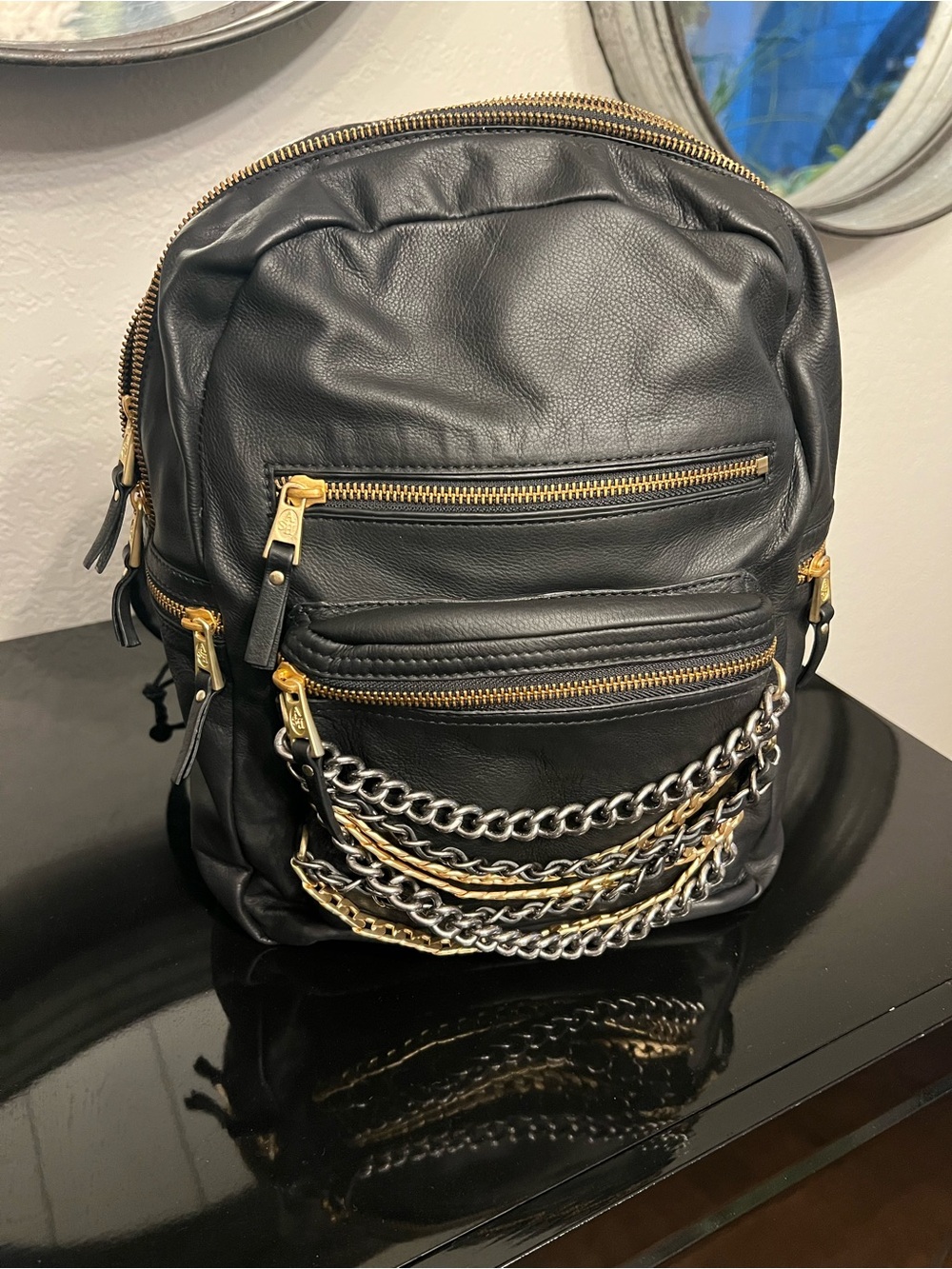 Ash Black Leather Backpack with Gold and Silver Chain Accents